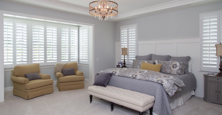 Plantation shutters in Salt Lake City bedroom.